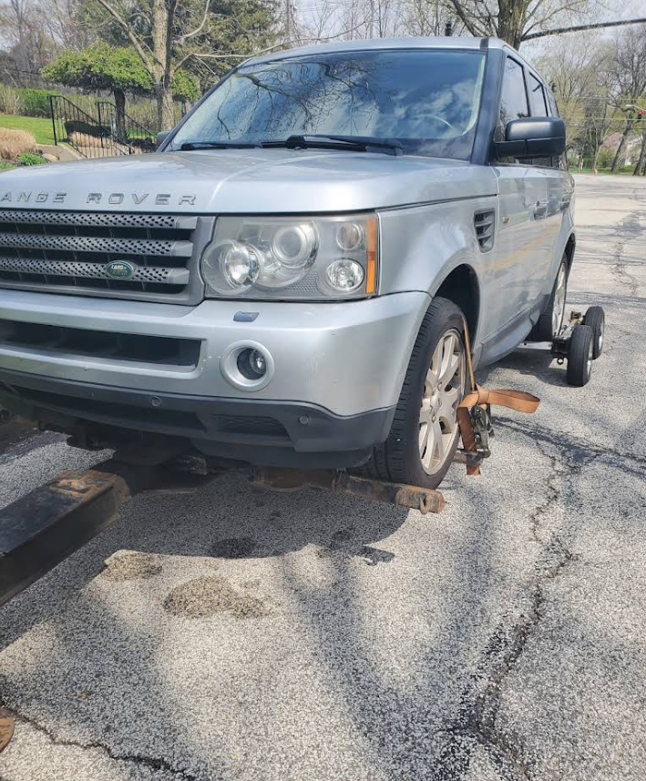 Customer vehicle safely loaded on a Rapid Recovery truck